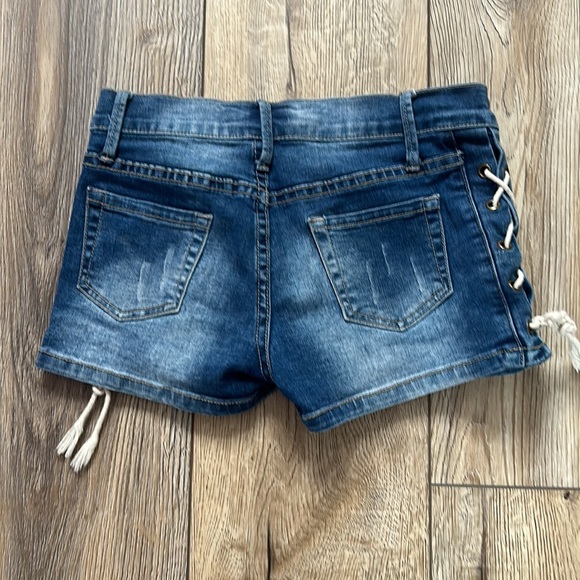 Blue ripped Jean shorts with tie design on sides comfortable stretchy material - Picture 3 of 3